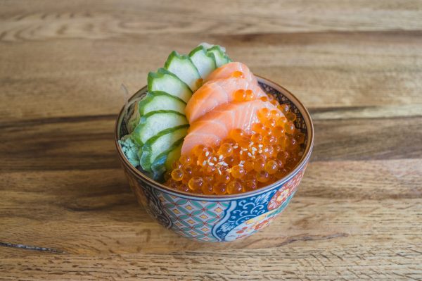 BIO salmon sashimi and marinade ikura on sushi rice bowl